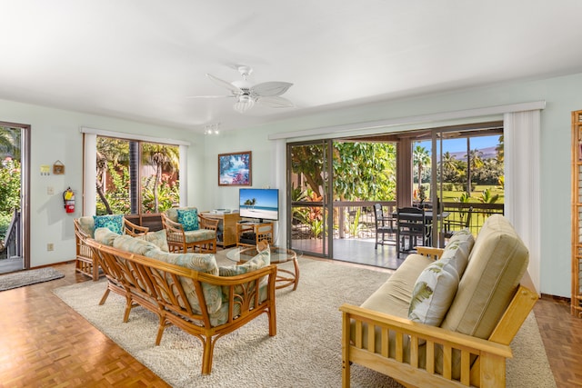 living room with light parquet flooring and ceiling fan