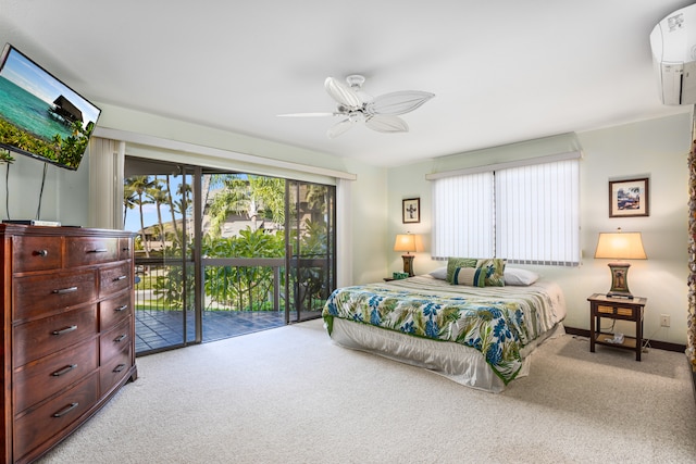 carpeted bedroom featuring ceiling fan, a wall mounted air conditioner, and access to outside