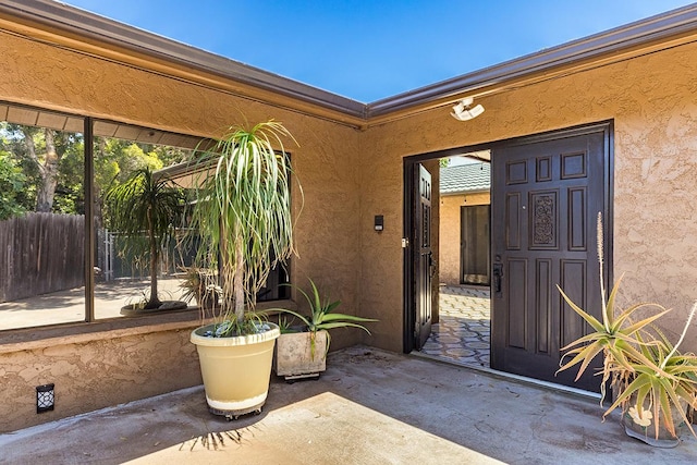 doorway to property with a patio