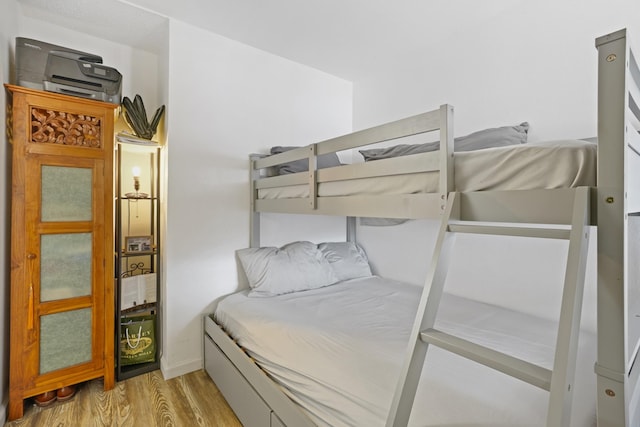 bedroom with light hardwood / wood-style floors