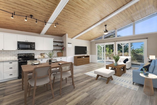 interior space featuring hardwood / wood-style floors, black appliances, ceiling fan, decorative backsplash, and white cabinetry