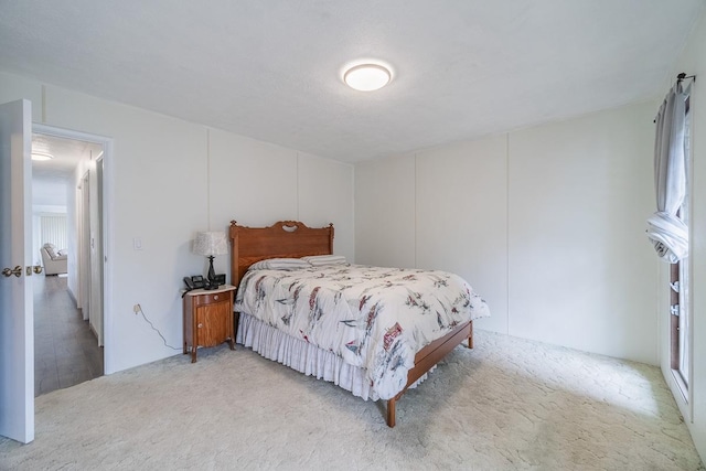 bedroom with light colored carpet