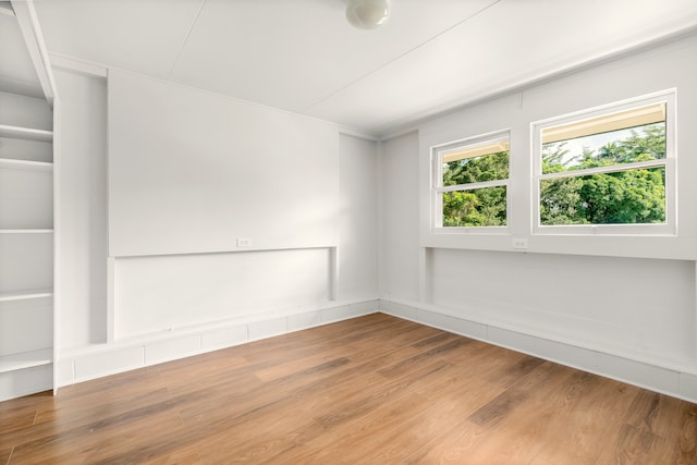 spare room with hardwood / wood-style flooring