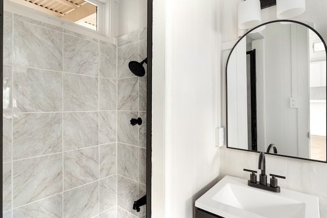 bathroom featuring vanity and a tile shower