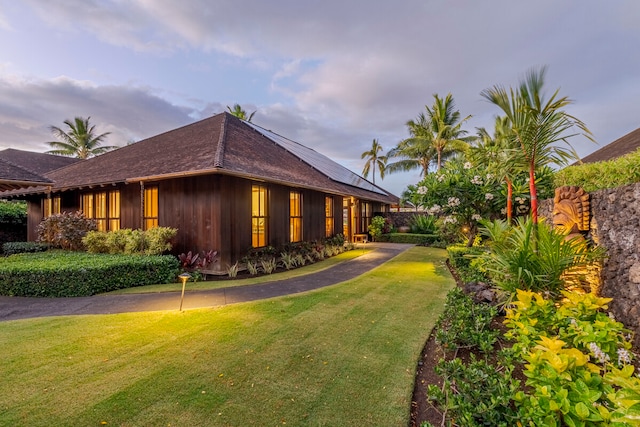 view of property exterior featuring a lawn