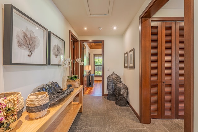 corridor with hardwood / wood-style floors