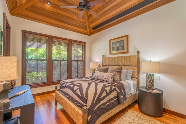 bedroom with lofted ceiling, wooden ceiling, ceiling fan, and hardwood / wood-style flooring