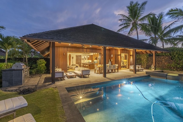 view of swimming pool featuring a patio area, outdoor lounge area, a pool with connected hot tub, and area for grilling