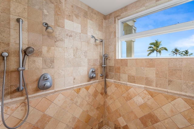 bathroom with a tile shower