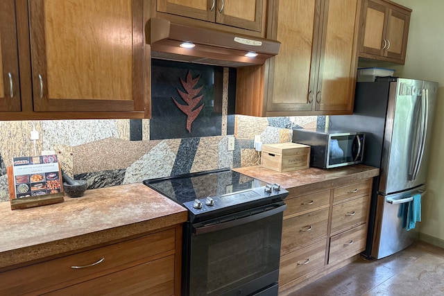 kitchen featuring appliances with stainless steel finishes and backsplash