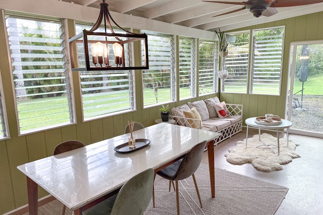 sunroom / solarium with ceiling fan, a healthy amount of sunlight, and beam ceiling