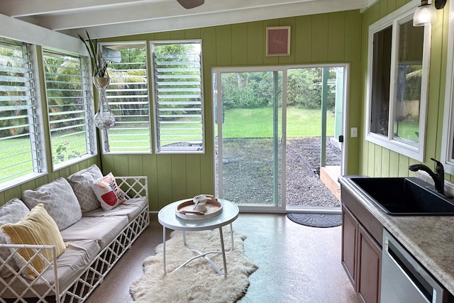 sunroom / solarium featuring sink and lofted ceiling