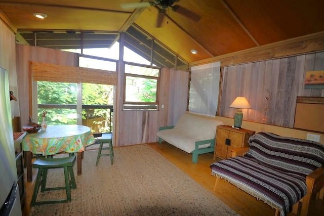 sunroom / solarium featuring ceiling fan and lofted ceiling