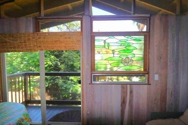 doorway featuring wood walls