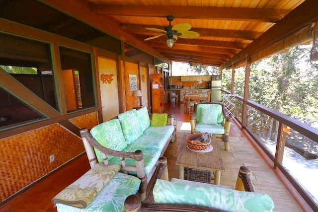 exterior space with wood ceiling, lofted ceiling with beams, and ceiling fan