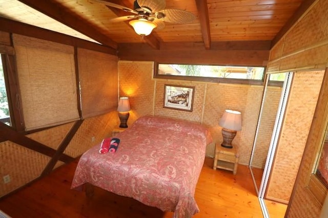 bedroom with vaulted ceiling with beams, light hardwood / wood-style flooring, wooden ceiling, and ceiling fan