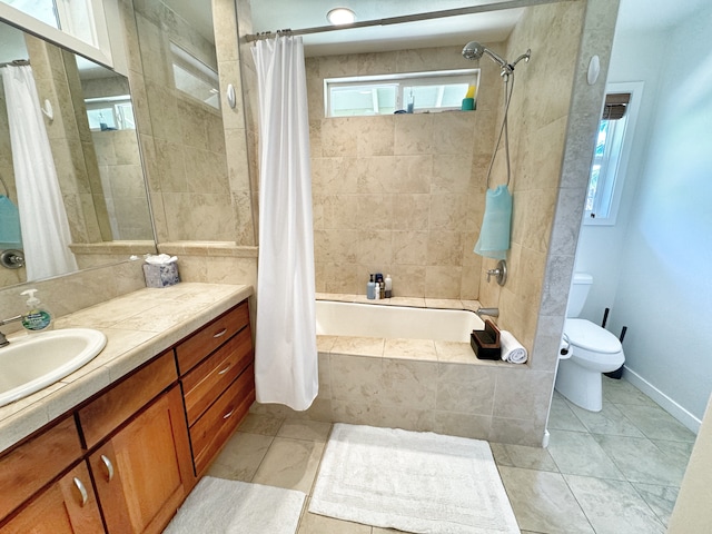 full bathroom featuring shower / bath combo with shower curtain, toilet, a wealth of natural light, and vanity