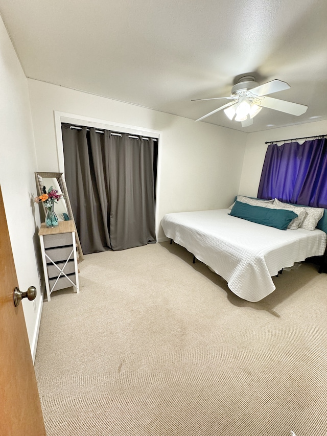 bedroom featuring carpet floors and ceiling fan