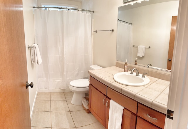 full bathroom featuring vanity, tile patterned floors, shower / bath combo, and toilet