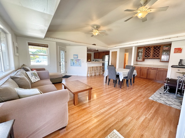 living room featuring light hardwood / wood-style floors and ceiling fan