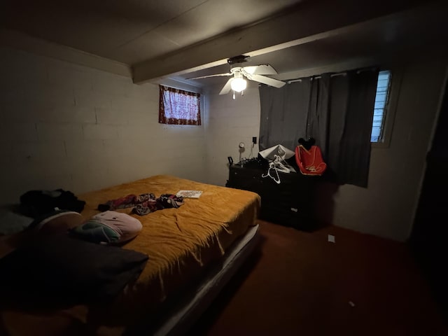 bedroom with ceiling fan and beam ceiling