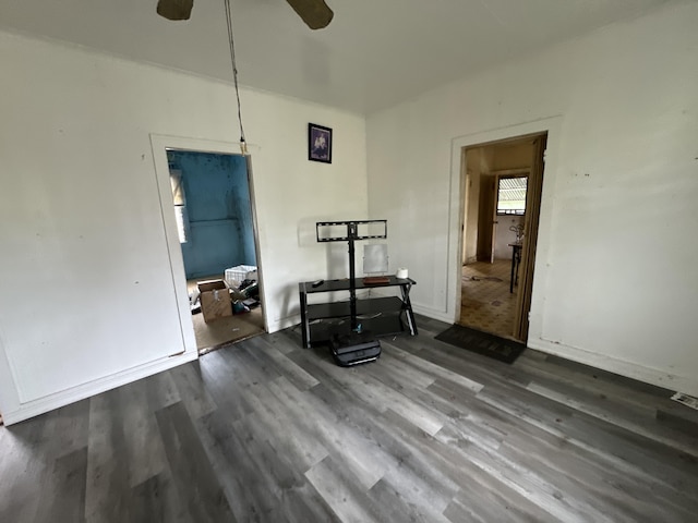 interior space featuring ceiling fan and dark hardwood / wood-style floors