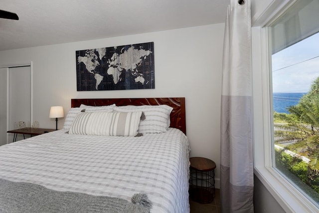 bedroom featuring a water view