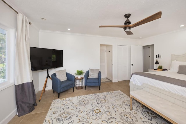 bedroom with light tile patterned flooring, ceiling fan, crown molding, and a textured ceiling