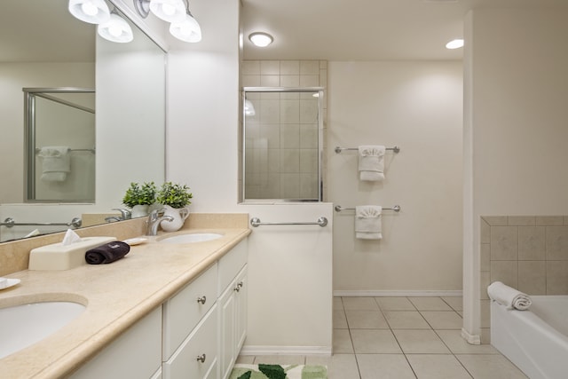 bathroom with tile patterned flooring, vanity, and separate shower and tub