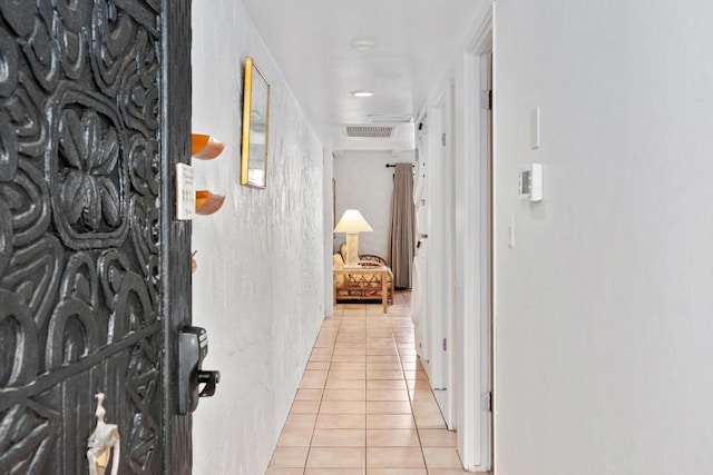 hallway with light tile patterned flooring