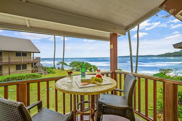 balcony featuring a water view