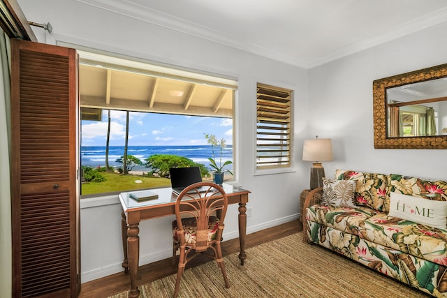 home office with crown molding, a water view, and hardwood / wood-style floors