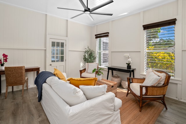 living room with hardwood / wood-style flooring and ceiling fan