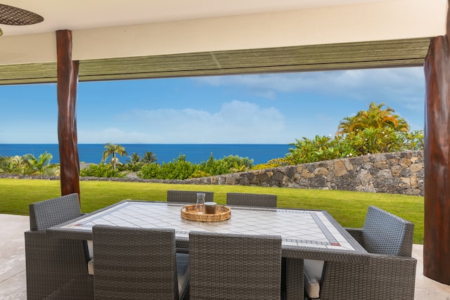 view of patio with a water view