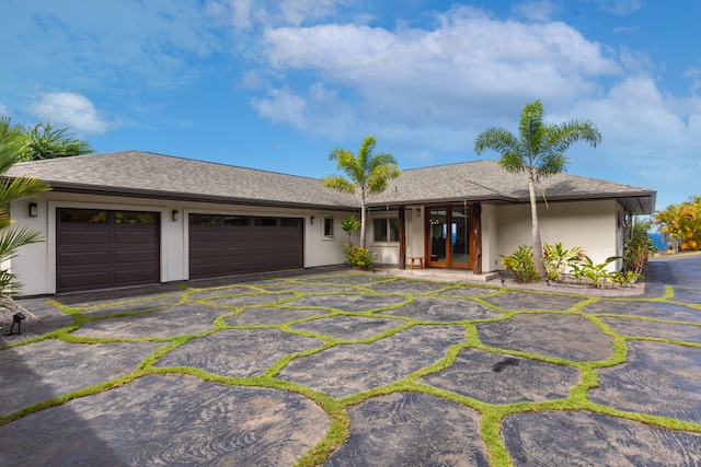 single story home featuring a garage