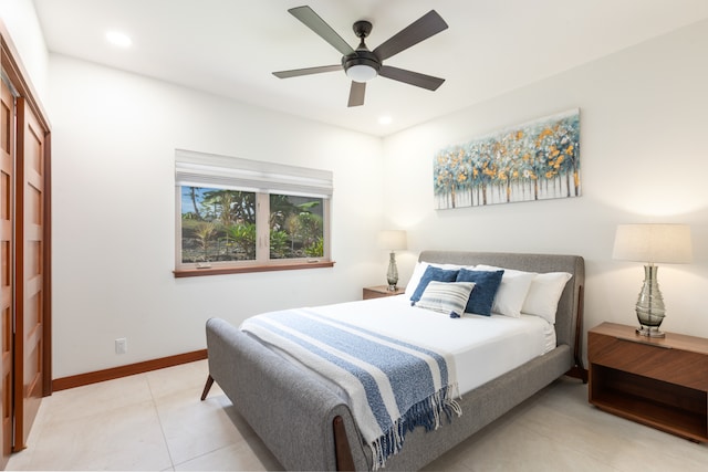 tiled bedroom with ceiling fan