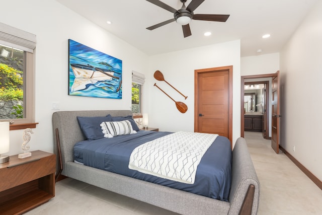 bedroom with ceiling fan and ensuite bath