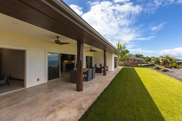 view of yard with a patio area and ceiling fan