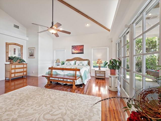 bedroom featuring multiple windows, wood-type flooring, ceiling fan, and high vaulted ceiling