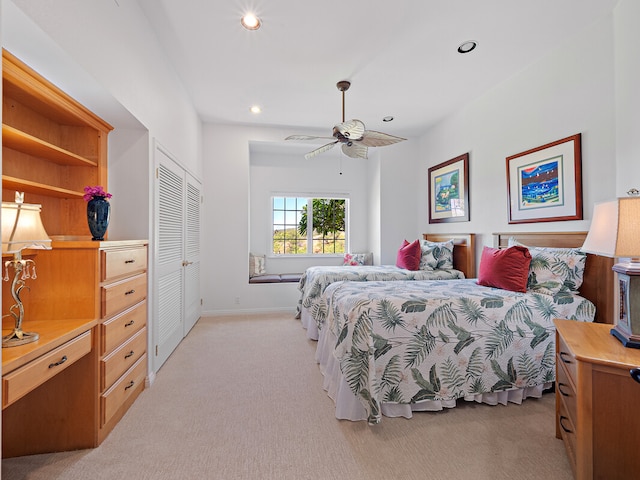 carpeted bedroom featuring a closet and ceiling fan