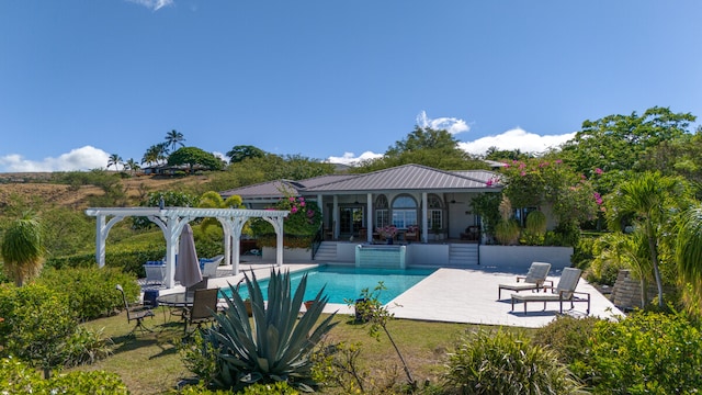 view of swimming pool featuring a pergola and a patio area