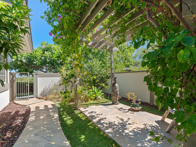 view of yard with a pergola and a patio