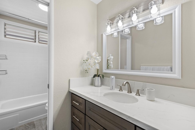 full bath featuring toilet, shower / bathtub combination, and vanity