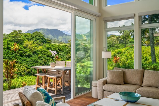 sunroom featuring a mountain view