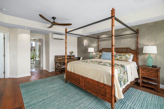 bedroom featuring a wall mounted AC, ceiling fan, and hardwood / wood-style floors