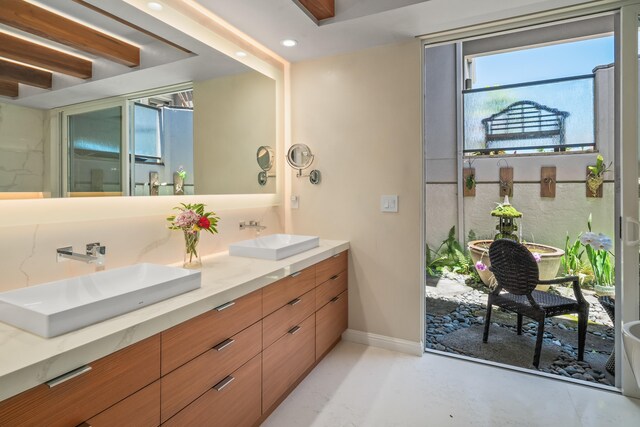 bathroom with dual vanity