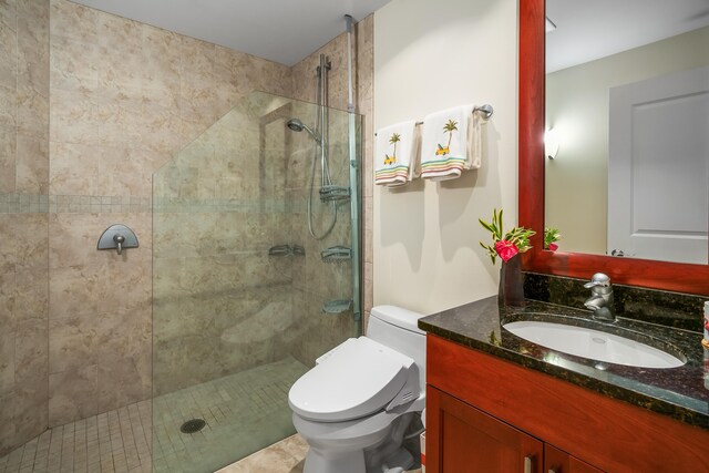 bathroom with vanity, an enclosed shower, and toilet