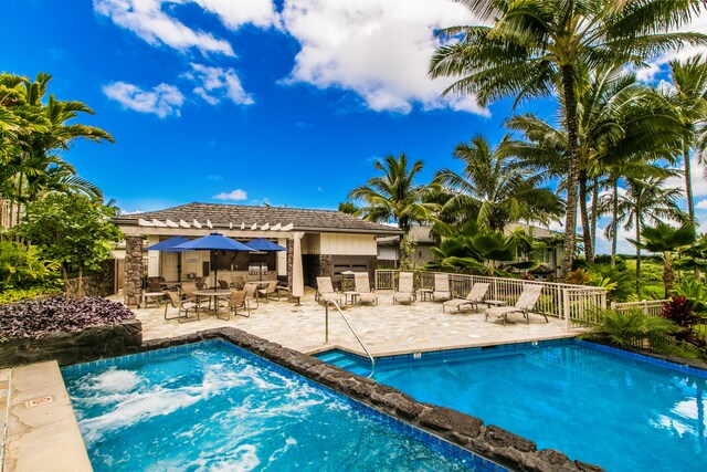 view of swimming pool featuring a patio area