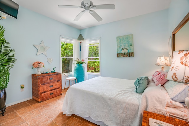 bedroom featuring light tile patterned flooring and ceiling fan