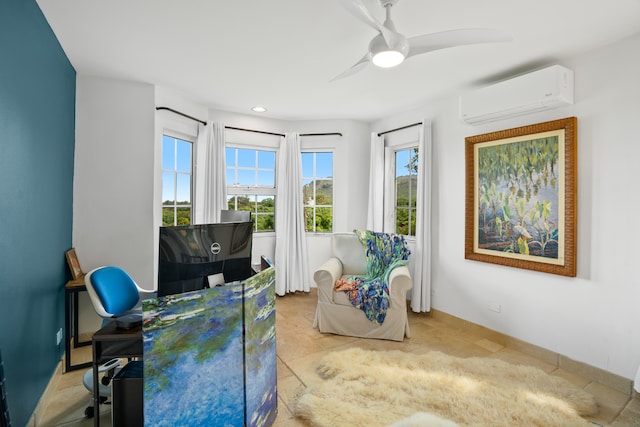 office space with a wall unit AC, light tile patterned floors, and ceiling fan